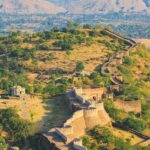 The lush greenery surrounding the fort, situated near the Kumbhalgarh National Park.