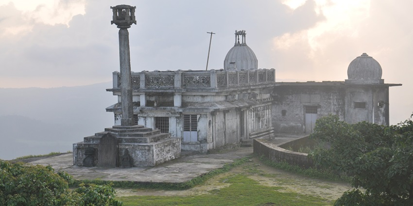 A scenic view of Kundadri Hills featuring the iconic Jain temple and lush greenery.