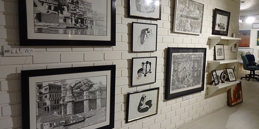 An image of featuring Indian miniature paintings hanging on the wall