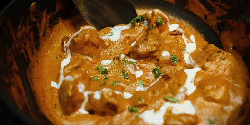 An image of Laal Maas is a fiery Rajasthani mutton curry, rich with chillies and garlic.