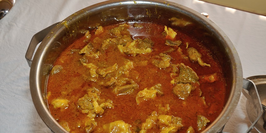 An image of Laal Maasis the spicy Rajasthani mutton curry with chillies, yoghurt, and rice.