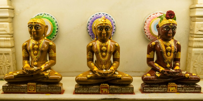 A glimpse of Ladnun Jain Temples featuring three figurines of Jain gods in Rajasthan.