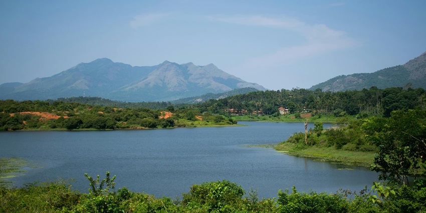 Image of a scenic shot of a Lake and distant hills and mountains - One of the best Vadodara picnic places
