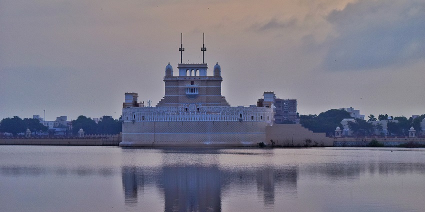 A serene view of Lakhota tourist attraction elegantly nestled in the middle of waters