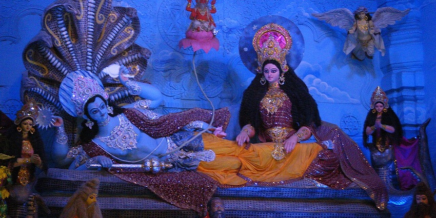 Lord Vishnu at Chattarpur Temple, showing a detailed sculpture in traditional attire.