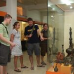 Visitors exploring exhibits at Lalbhai Dalpatbhai Museum, showcasing cultural artefacts.