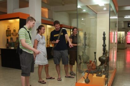 Visitors exploring exhibits at Lalbhai Dalpatbhai Museum, showcasing cultural artefacts.