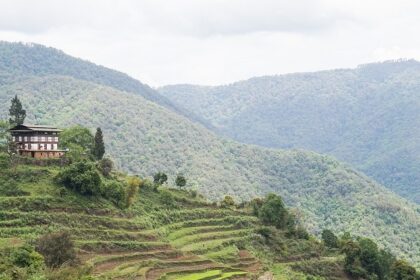 The best places to visit in Bhutan in May include this scenic landscape showing Bhutan’s lush mountains and valleys.