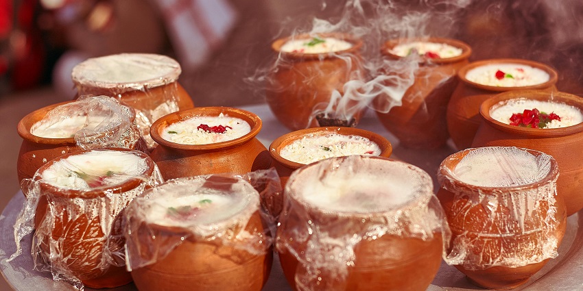 Refreshing kuladhs of lassi served with malai garnished with nuts