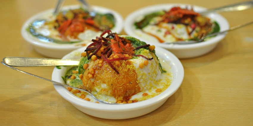 Street food stalls at Ratri Bazaar serve a variety of delicious late-night snacks.