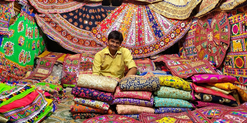 View of a shop displaying vibrant traditional Gujarati dresses