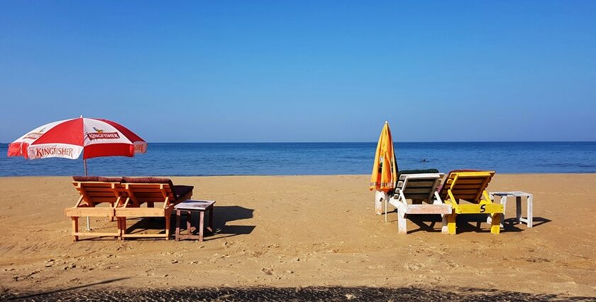 A tranquil view of Keri Beach with soft sands and gentle waves in North Goa, India.