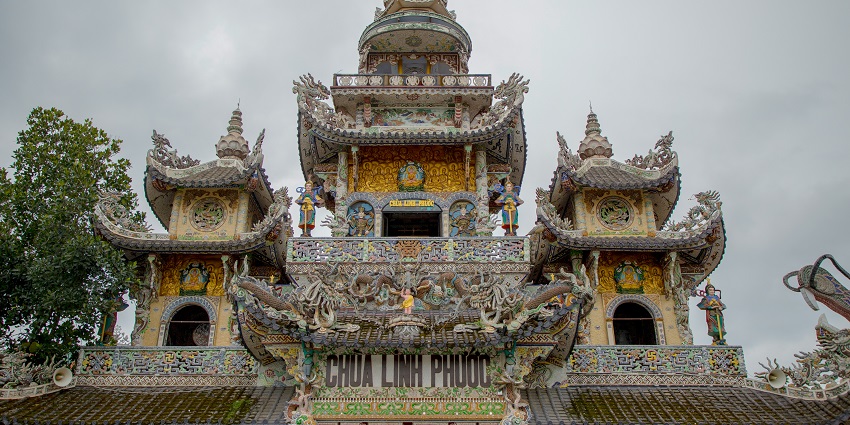 A front view of the Linh Phuoc Pagoda, a renowned tourist destination in Vietnam.