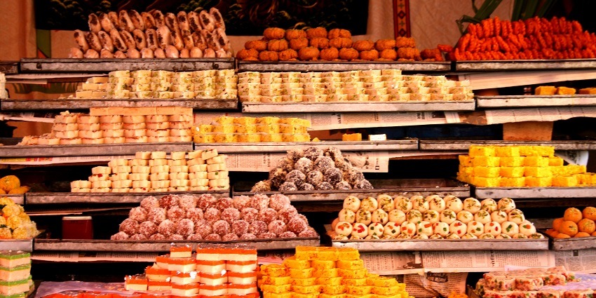 A vibrant scene in Khatu Shyam with local eateries serving authentic Rajasthani dishes.