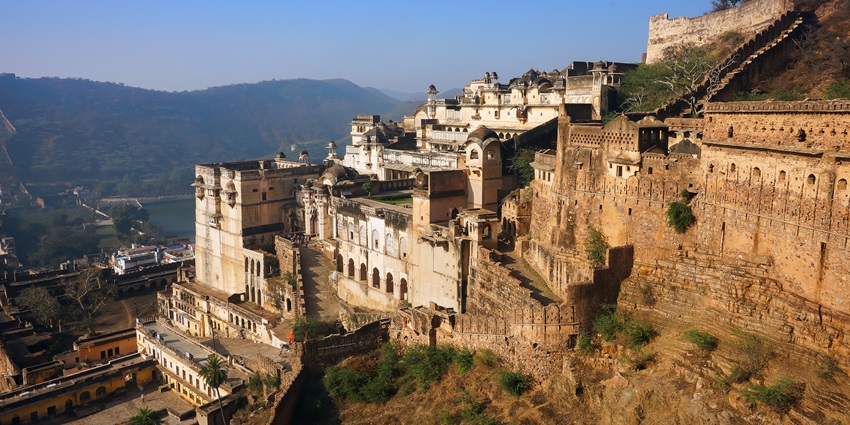A breathtaking lush green view from the garden in Garh Palace upwards to Taragarh Fort.