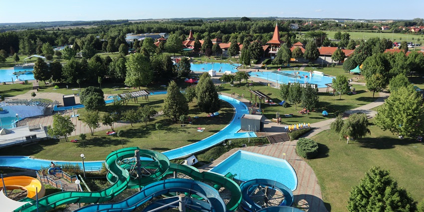 Lush green plants and fields justifying the serene location of AATAPI Water Park.