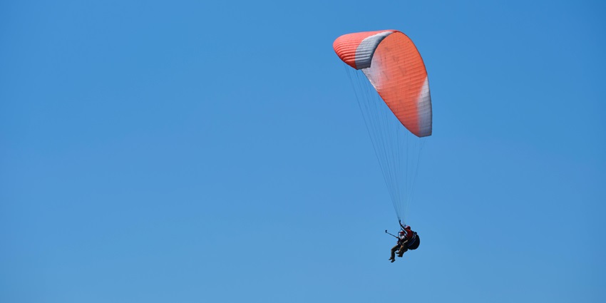 Enjoy Kasauli paragliding to view pine and oak trees and stunning structures