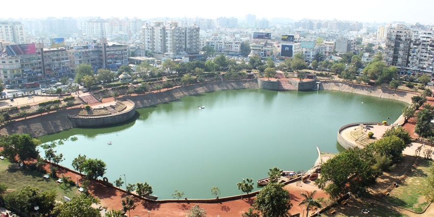Aerial view of Vastrapur lake surrounded by lush greenery near the Vastrapur Adventure Park