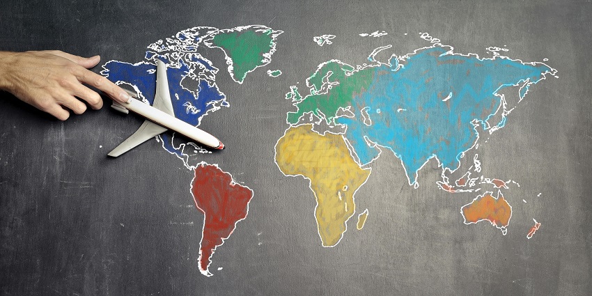 A stunning frontal view of a blackboard with a colourful map drawn on it with aeroplane.