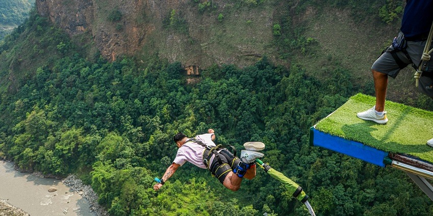 A stunning aerial view of a man trying an adventurous activity during the daytime.