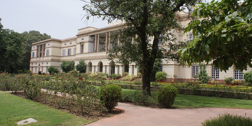 A stunning view of the prime minister museum surrounded by green trees during the day.