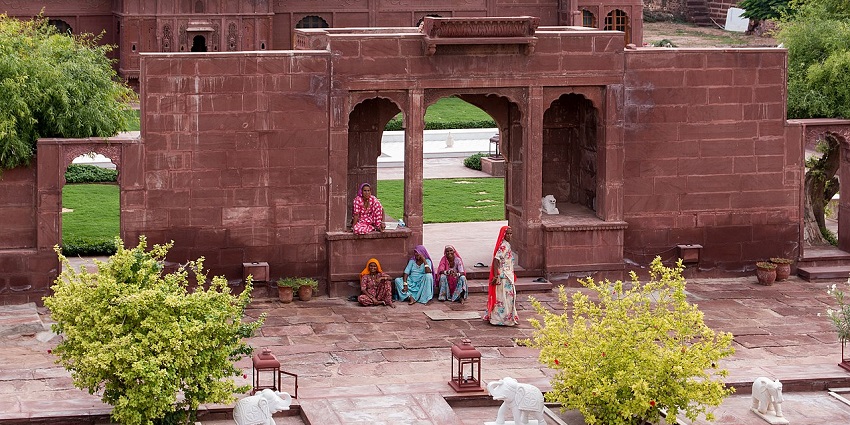 Scenic view of door of the enclosed garden of the fort and group of Rajasthani ladies