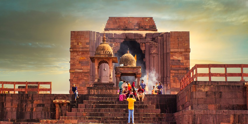 An image showing a lively entrance of Bhojpur Temple, alive with the buzz of devoted worshippers.