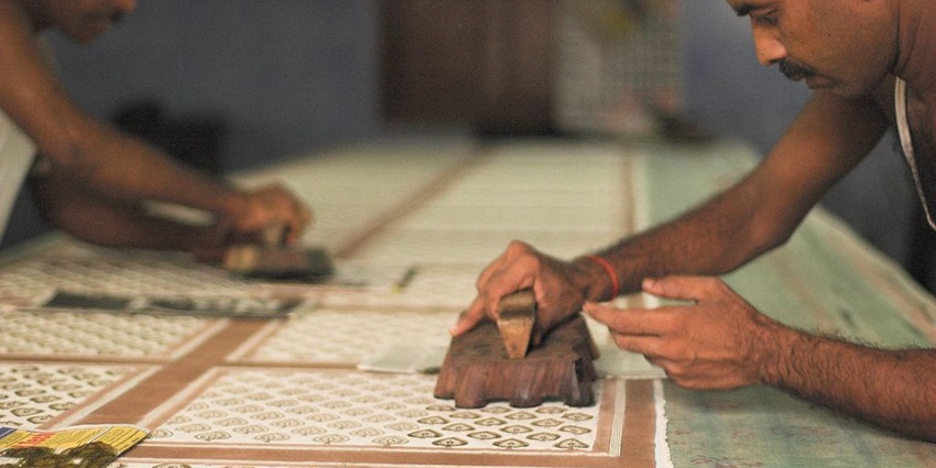 Hand-carved wooden block used for textile printing at the Anokhi Museum, showcasing craftsmanship.