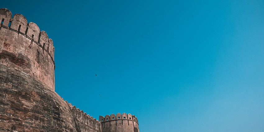 A scenic view showcasing the serene location of the famous Tatarpur Fort in Rajasthan.