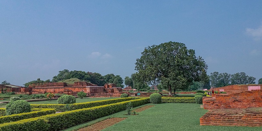 A garden with various archaeological site from the Nalanda Mahavihara site in Bihar.