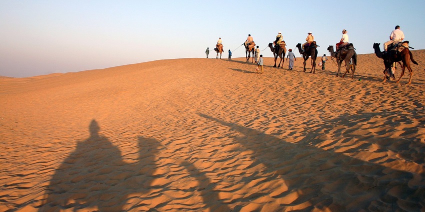 A camel ride through the Khuri sand dunes in the Thar Desert near Jaisalmer, Rajasthan.