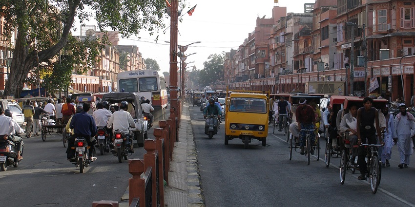 A bustling downtown scene in Jaipur, India, showcasing vibrant streets and architecture.
