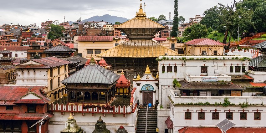 A clear view of the Pashupatinath Temple in Kathmandu illuminated and visible with its surroundings.