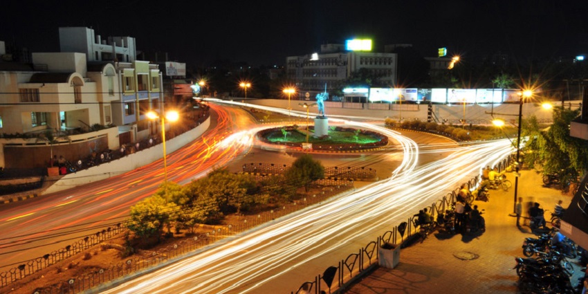 Underbridge Circle in Rajkot at night, illuminated with lights near the Watson Museum Rajkot.