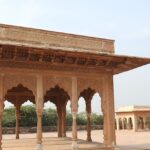 A breathtaking view of the Lohagarh Fort with breathtaking views of a waterbody.