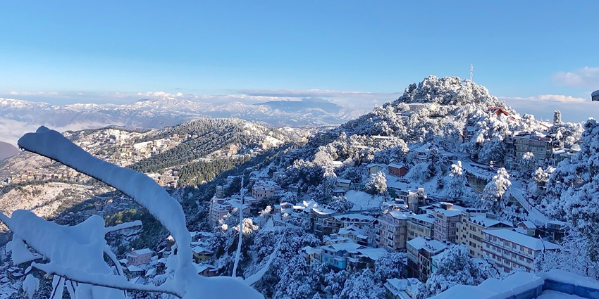 View of charming houses nestled in the snowy region of Longwood, Shimla