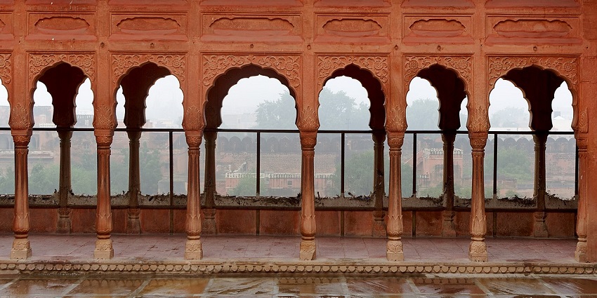 Luni fort with red sandstone façade, carved jharokhas, and heritage hotel interiors reflecting Rajput architecture.