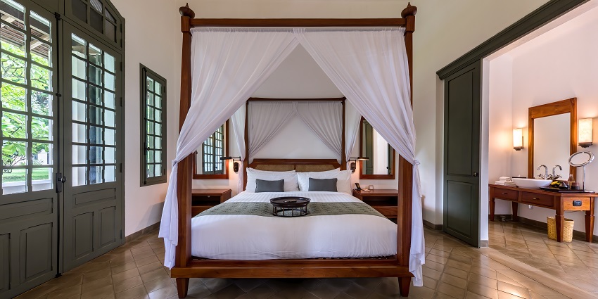 A picture of a hotel room with all the basic amenities at the Raj water park and resort