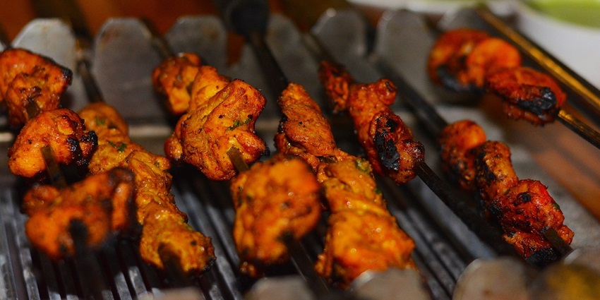 M.I. Road offers a vibrant mix of street food, from sizzling kebabs to creamy falooda