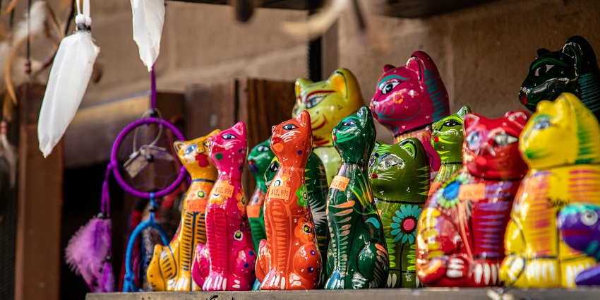 A vibrant night market scene at Mackie’s Night Bazaar, filled with colourful stall