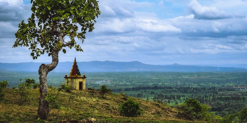 A scenic vista of the spiritual tourist attraction on a hill surrounded by greenery.
