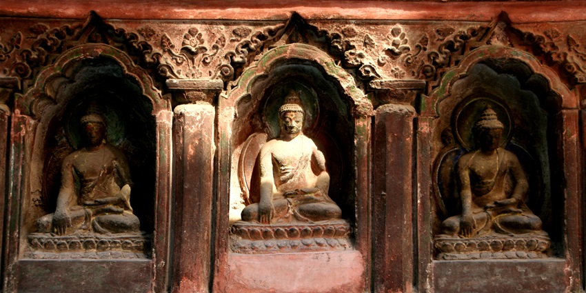 Sunlight illuminating a Buddha carving at the Mahabuddha Temple, near Patan Museum.