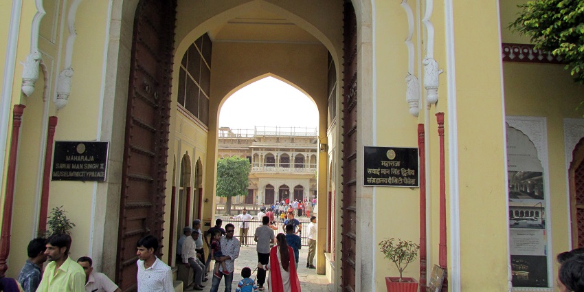 The entry gate of Sawai Man Singh Museum, a top museum in Rajasthan, featuring an ornate architectural design with traditional motifs.