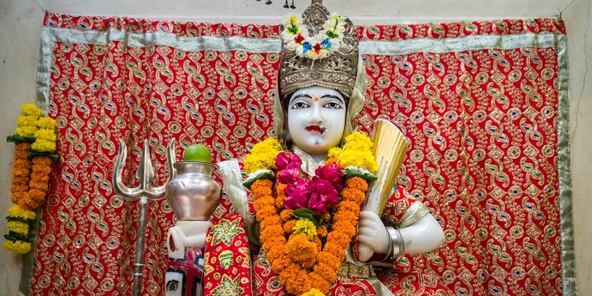 Image of a beautiful idol of Sitla Devi at a temple - one of the best temple to visit in Mahudi