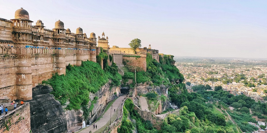 Aerial view of a fort surrounded by lush greenery and a scenic landscape.