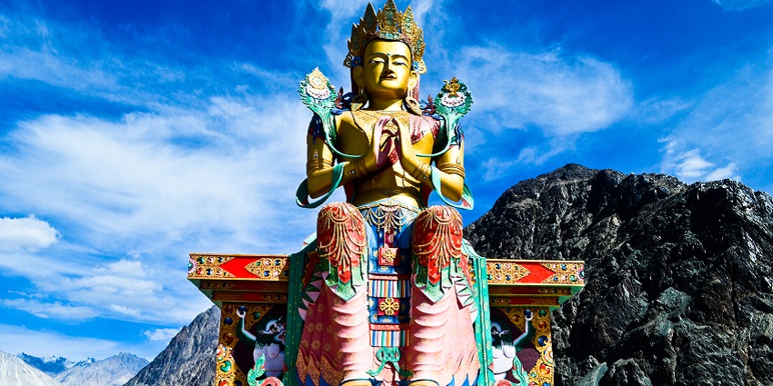 Panoramic image of the Giant Maitreya Buddha Statue in the hills of Himalayas in Nubra valley