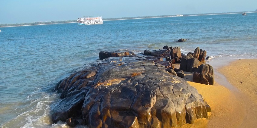 These beaches offer unique experiences like Malpe featuring a large rock near waves.