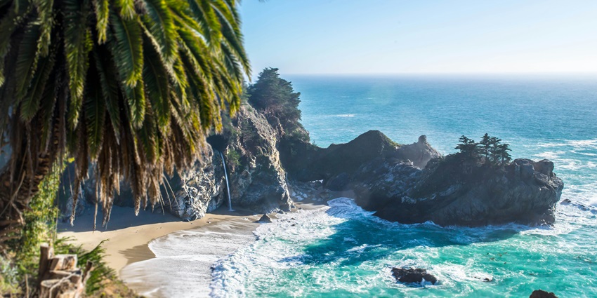 The large rock formation featuring a textured surface, surrounded by serene backdrop.