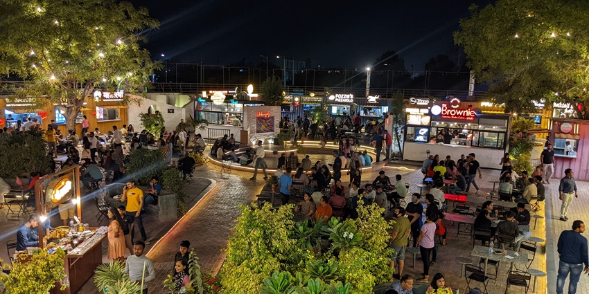 Manek Chowk bustling with activity, vibrant markets, and historic architecture.