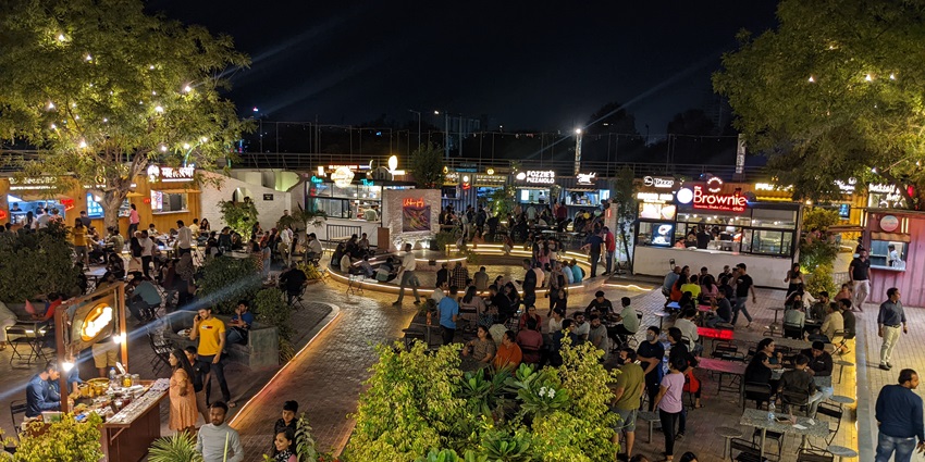 A lively night at Manek Chowk night market and bustling people hanging out
